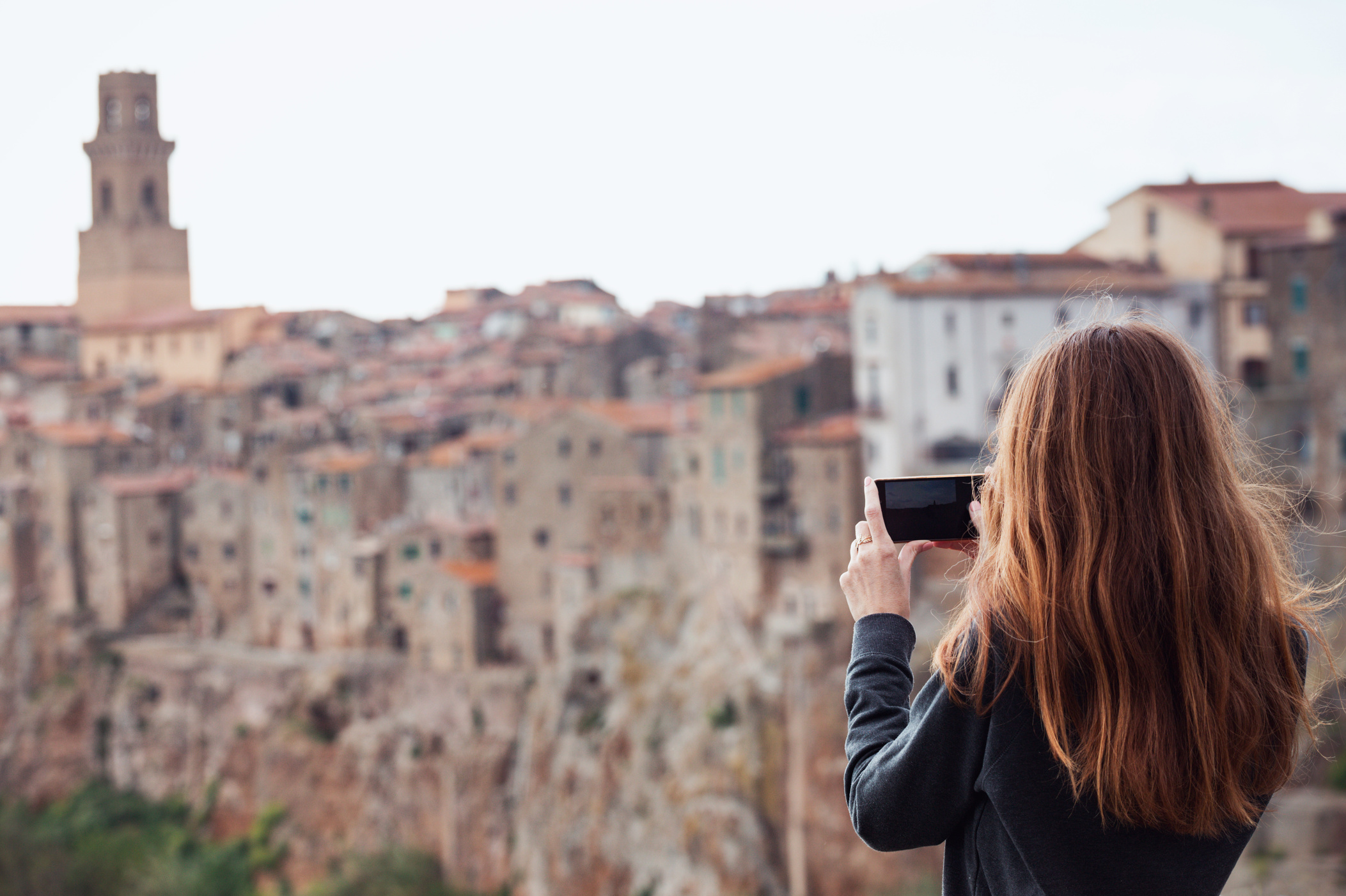 Girl Taking Photo of Cityscape with Phone